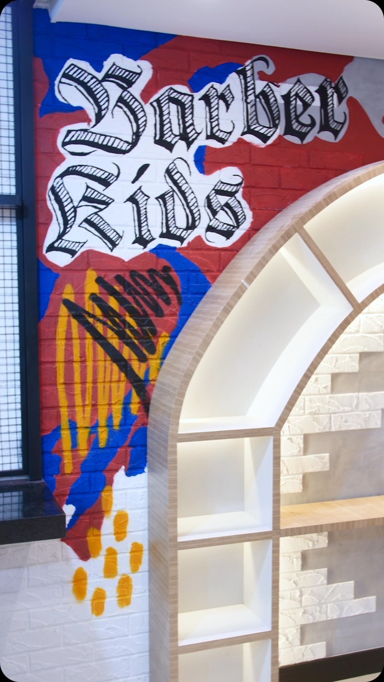 Colourful mural on a brick wall in a children's space