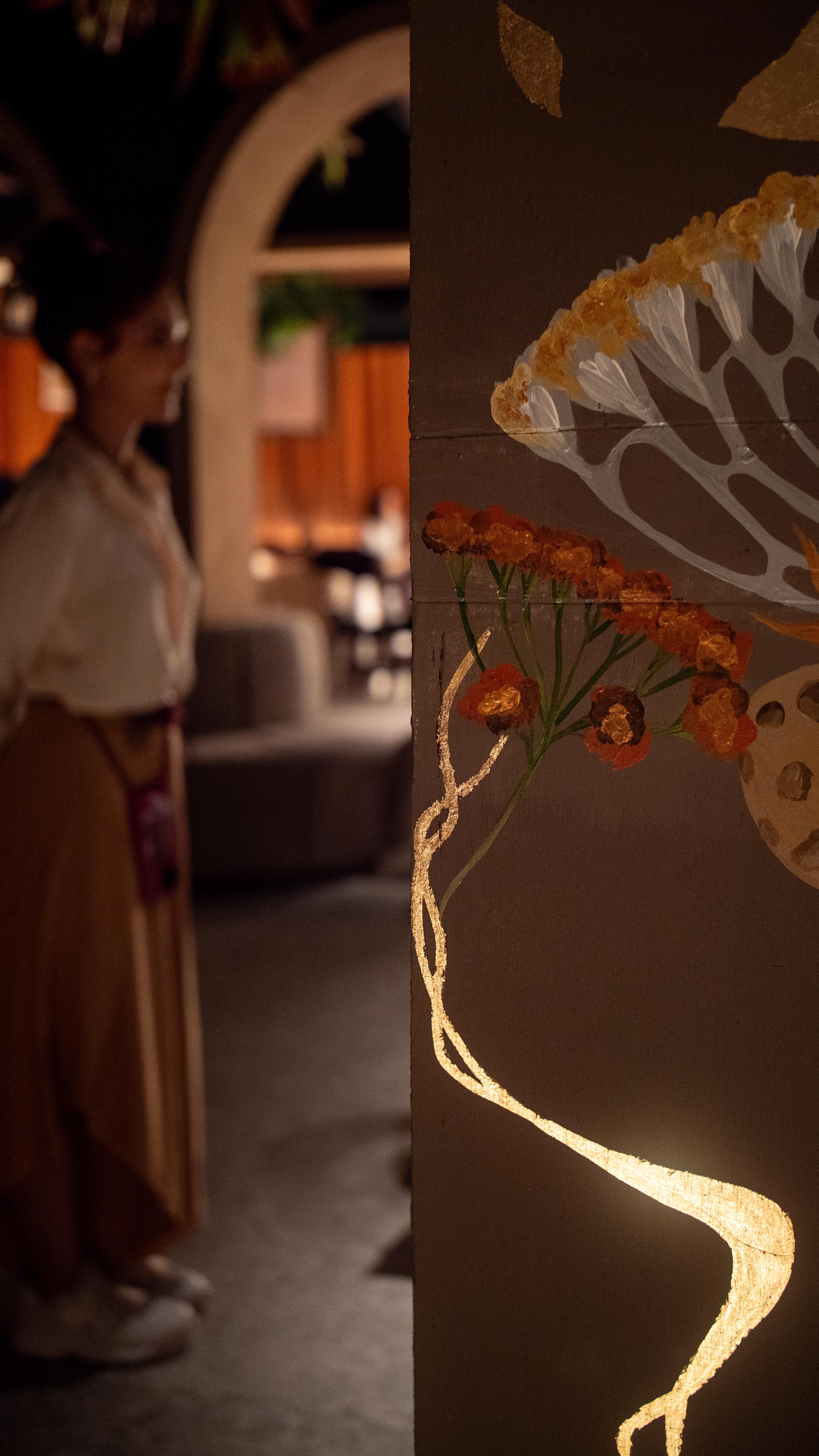 Gold-leaf detail of the Mayu Restaurant painting